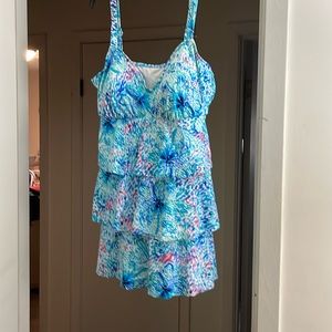 Miracle suit size 18 ruffles in front never been wore bought at Dillards